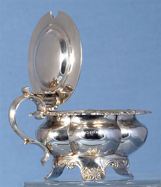 A set of four George III provincial silver table salts with matching mustard, Diameter 3 ¾”/94mm combined weight 21.5oz/609grm